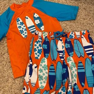 Boys size 5 swim trunks and rash guard